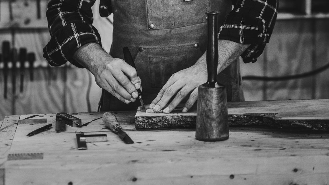 Craftsman using hand tools